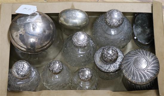 Nine assorted silver mounted scent bottles, dressing table jars etc. and a silver trinket box.